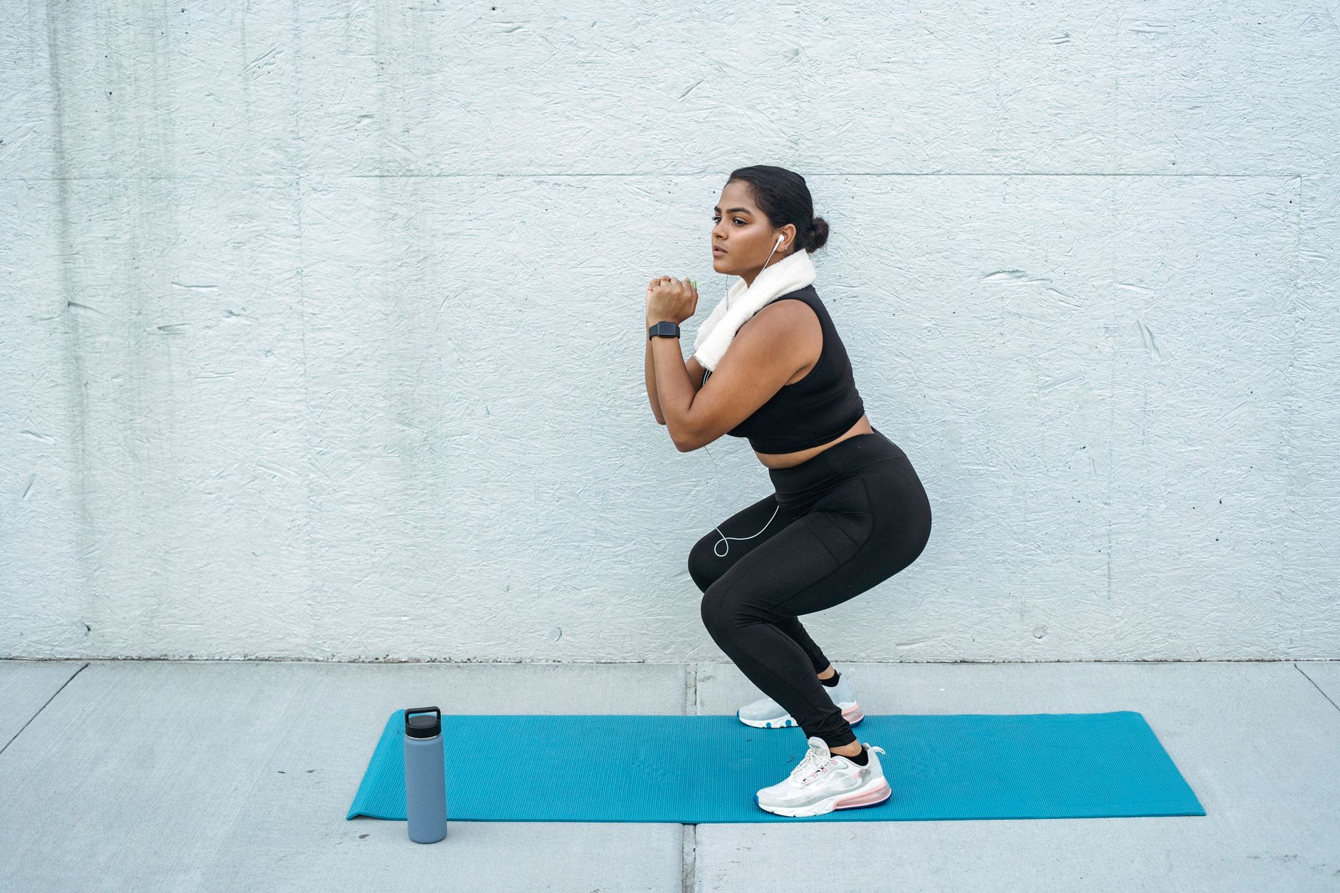woman squat exercise living room