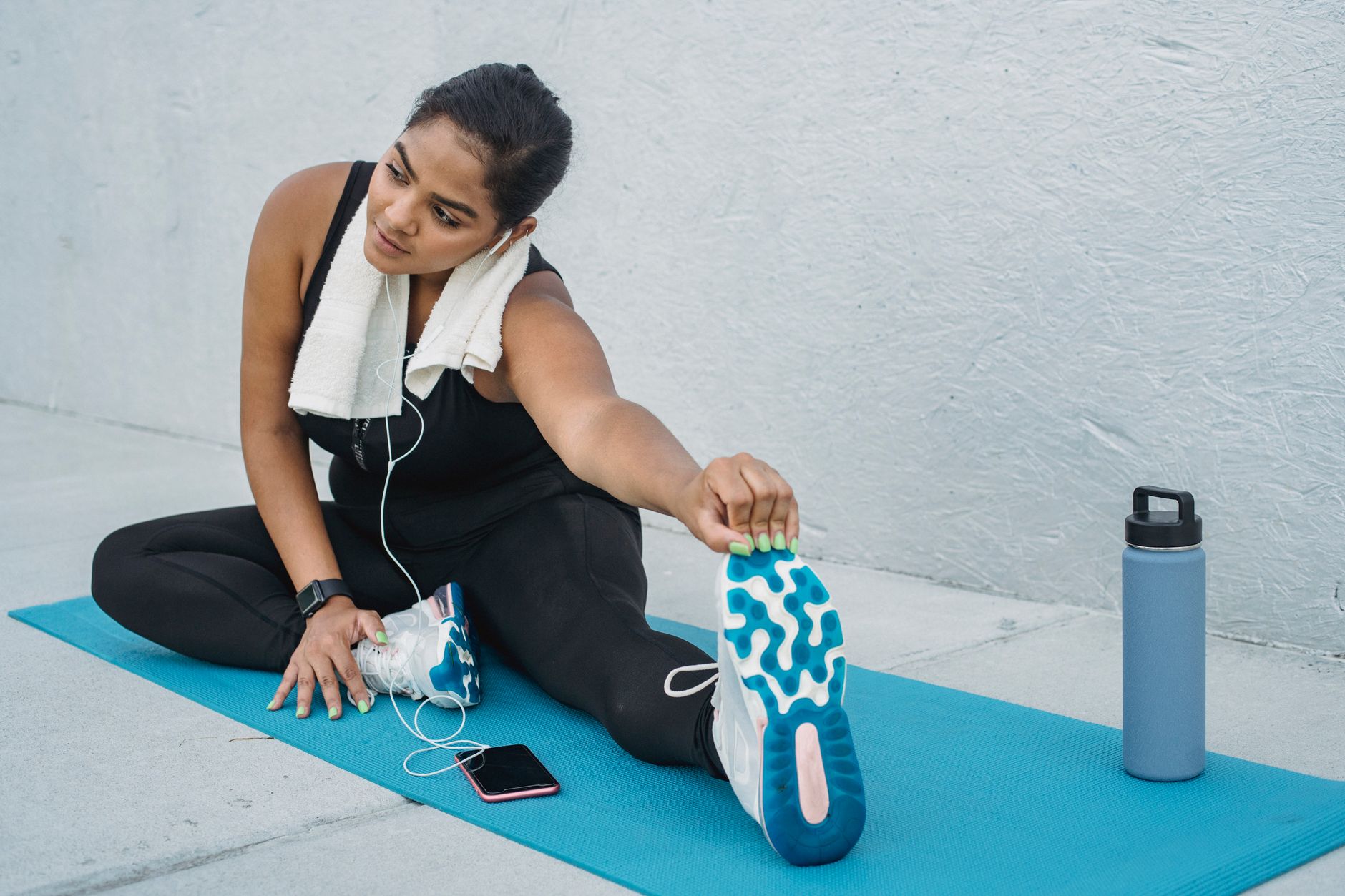 woman stretching yoga mat