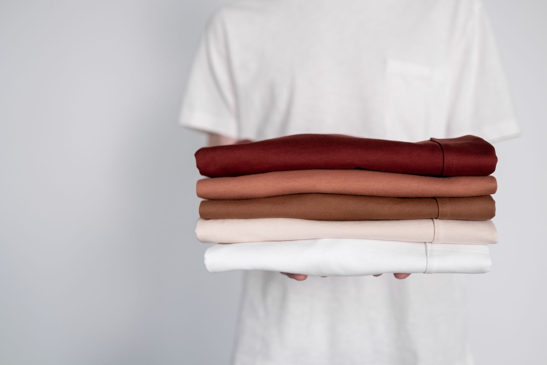 activewear folded stack white background