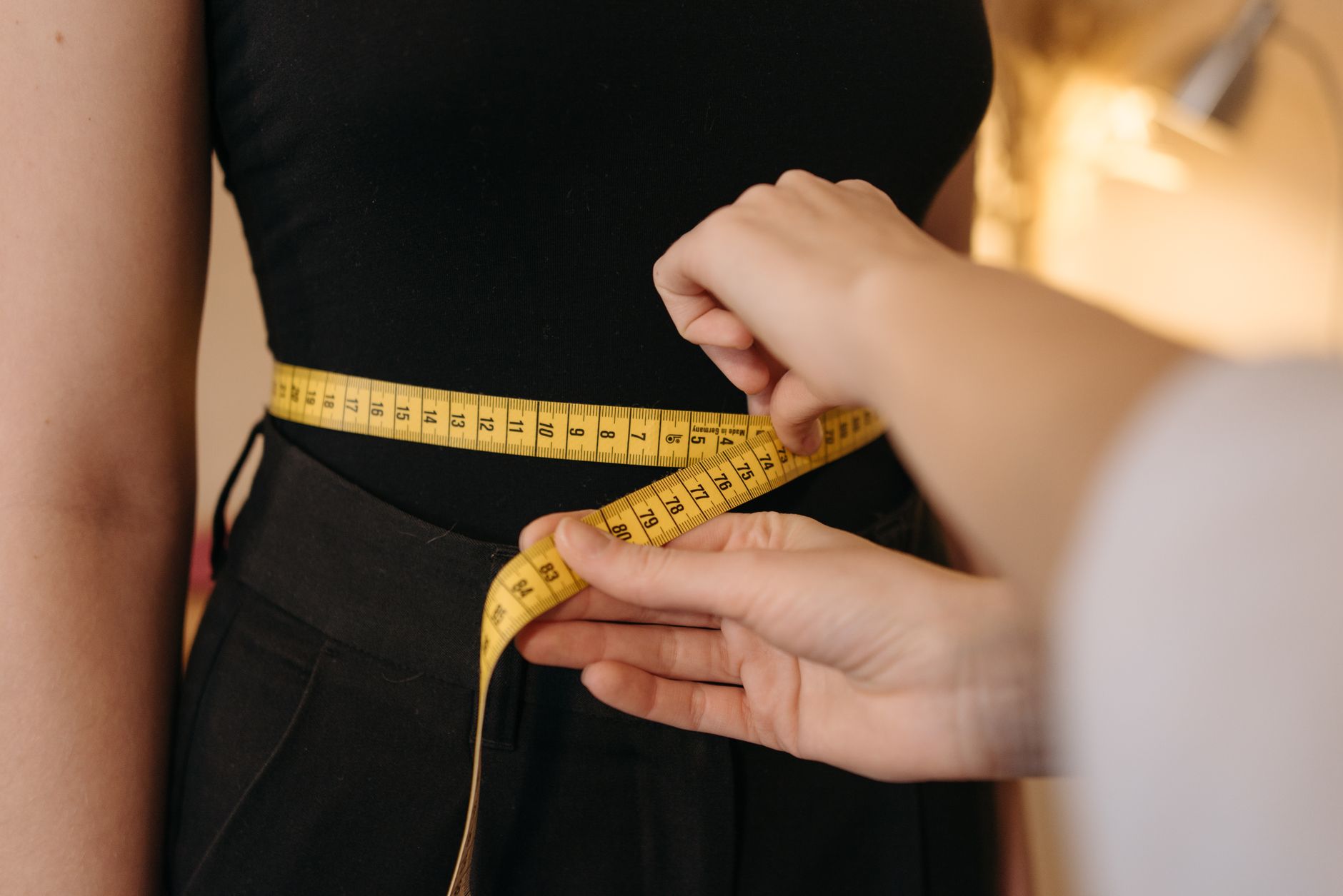 measuring tape hands sewing