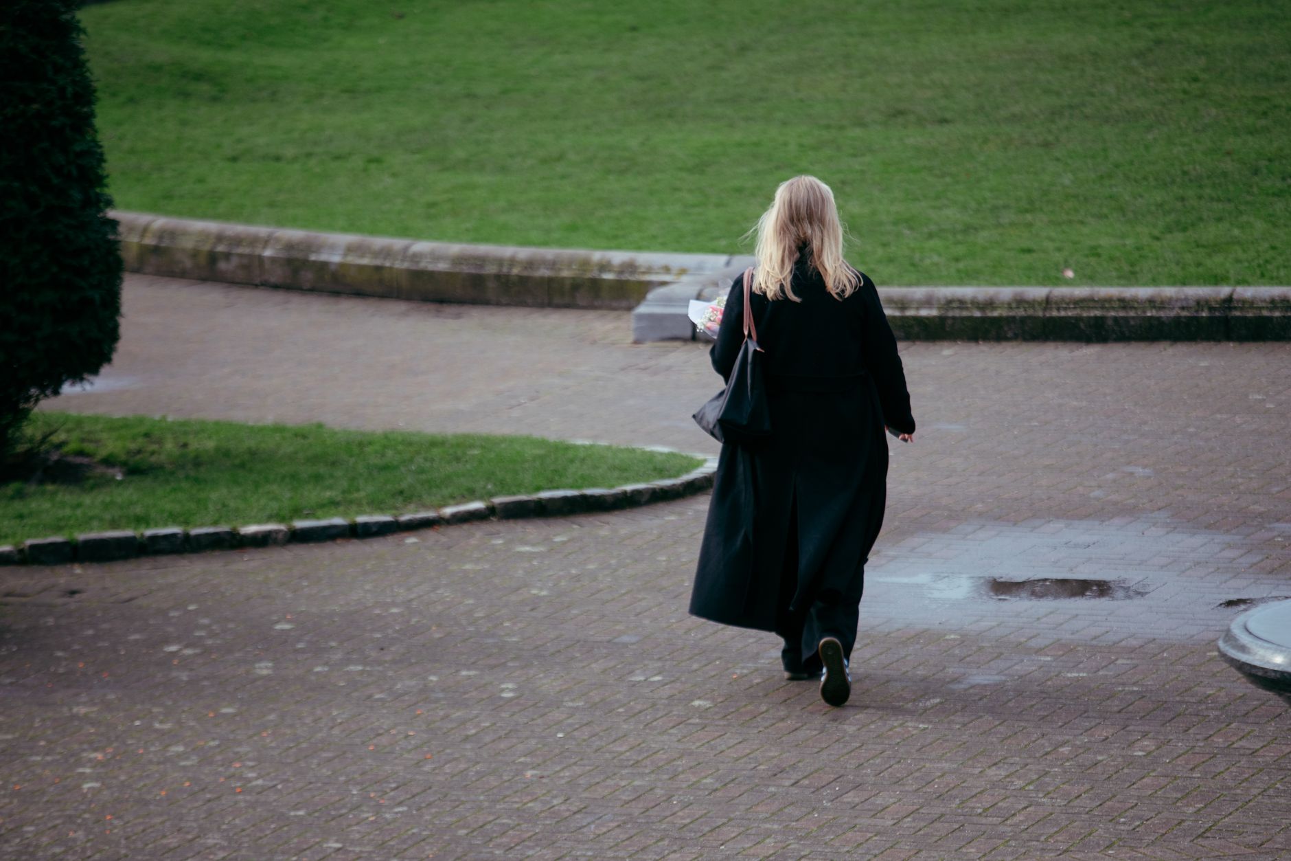 woman walking briskly park