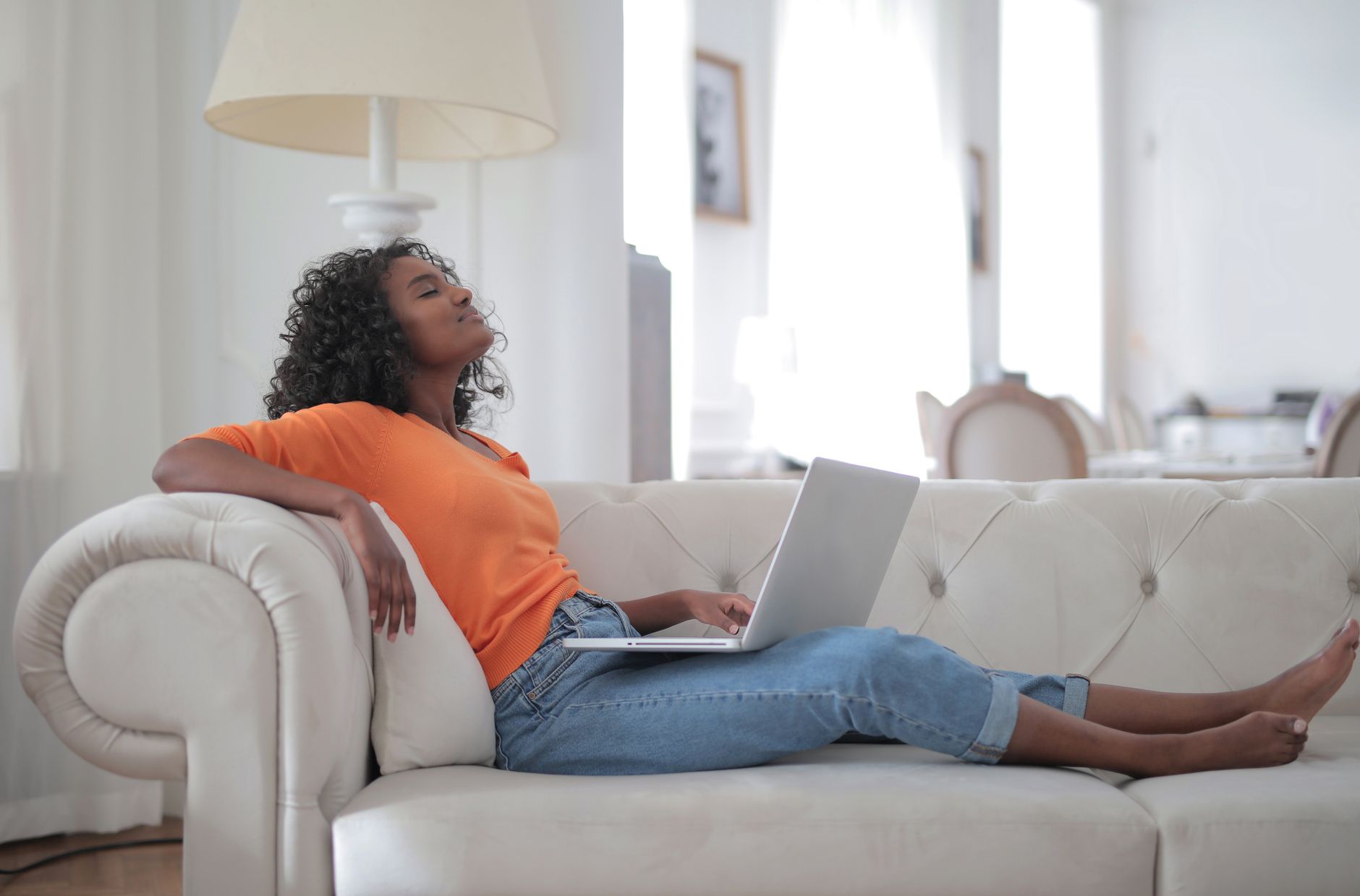 woman relaxing back sofa