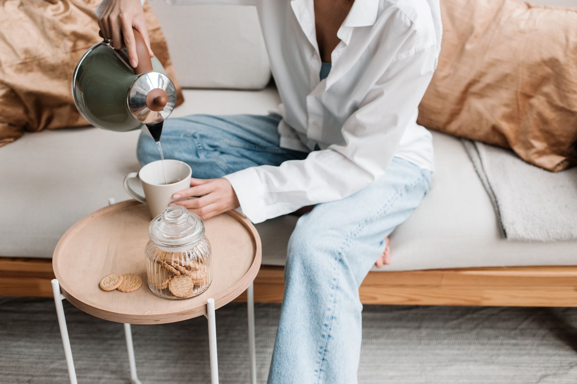 woman relaxing sofa evening tea