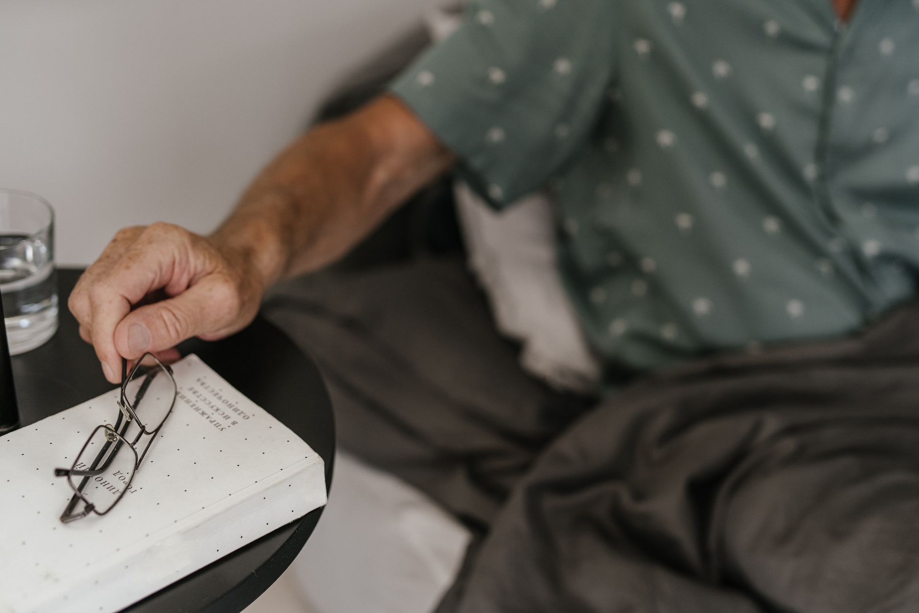hand resting bedside table