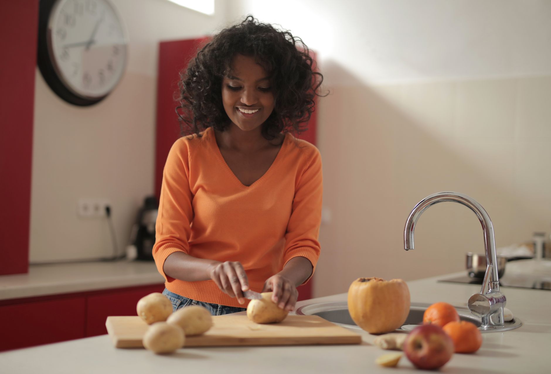 woman chopping vegetables kitchen