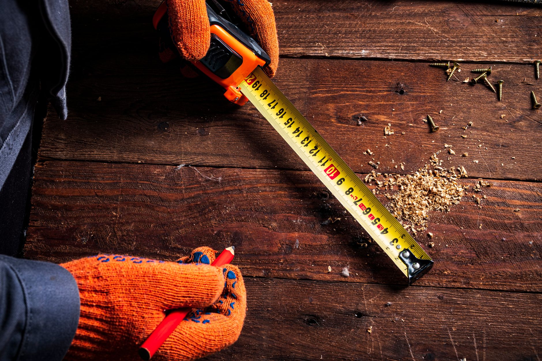 hands measuring tape kitchen counter