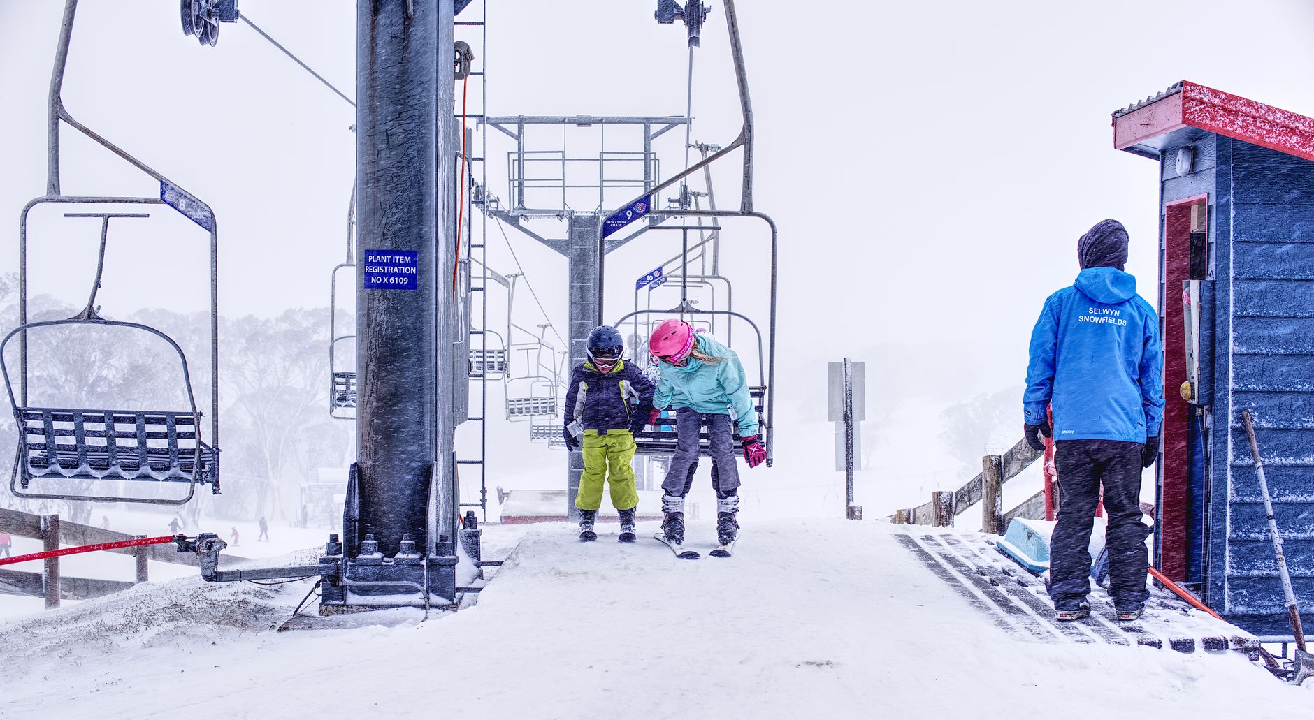 children skiing snow lesson