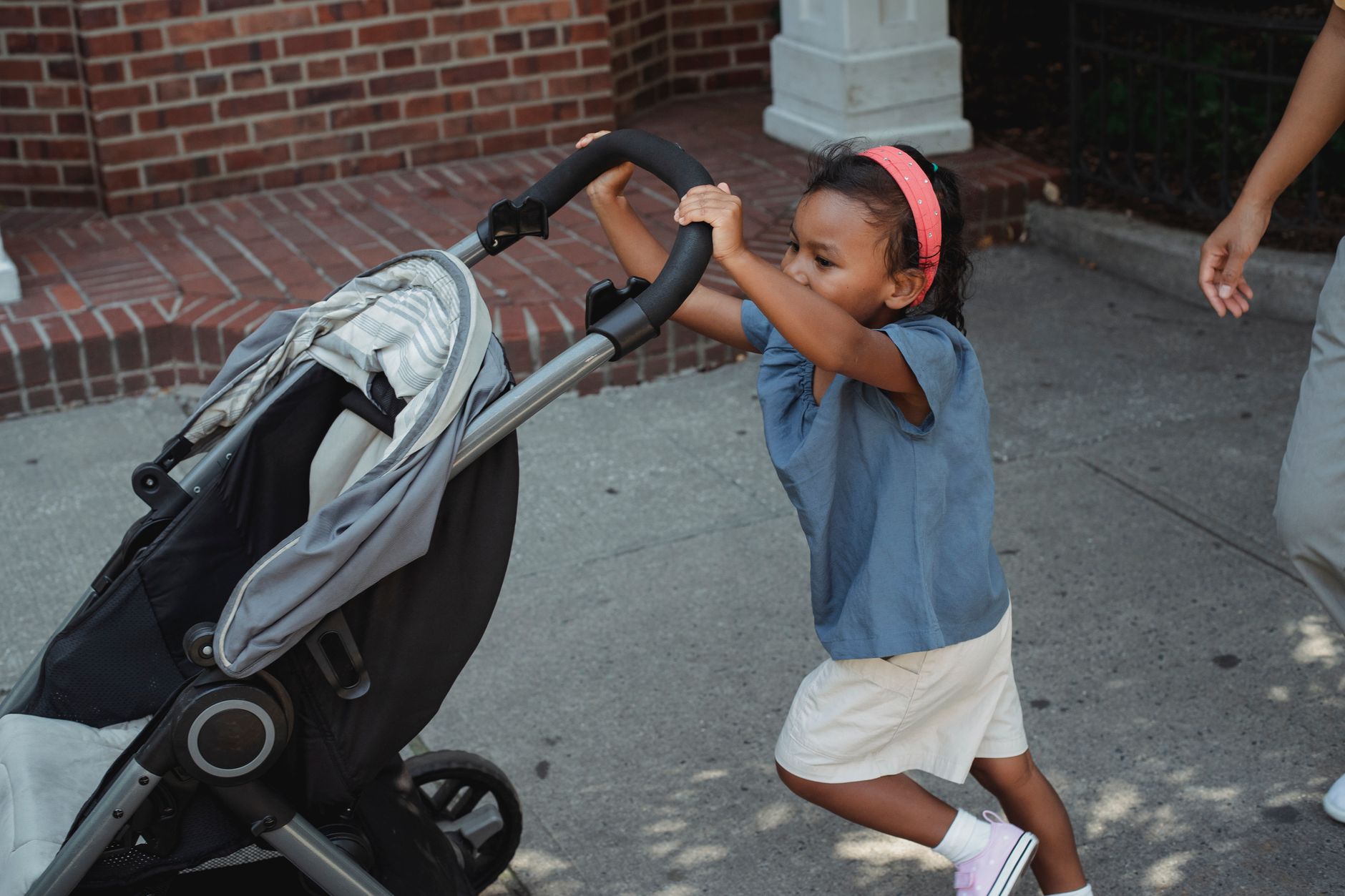 parent pushing stroller airport